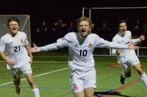 Alex Alma celebrates a goal in the 69th minute of a Oct. 24 Class AA quarterfinal game against New Rochelle. Sports Editor Mike Smith was hoping to make the shot a front page tease, but New Rochelle had other ideas. Photo/Mike Smith