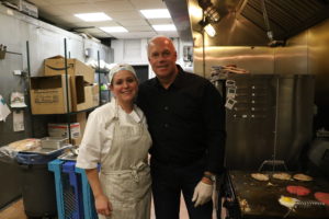 Nora Brunnett and Bill Powell, of Powell’s Catering, pause to pose for the Review during Visiting Chef Night. Brunnett is the owner of Nora’s Ovenworks in Harrison. Photos/Andrew Dapolite