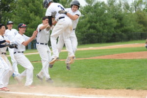 Eastchester celebrates Anthony Belmonte’s walk-off hit against Lakeland on May 21. Eastchester won its first-round playoff game before falling to Brewster on May 23. Photo/Bobby Begun